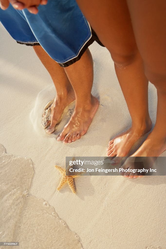 South American couple next to starfish