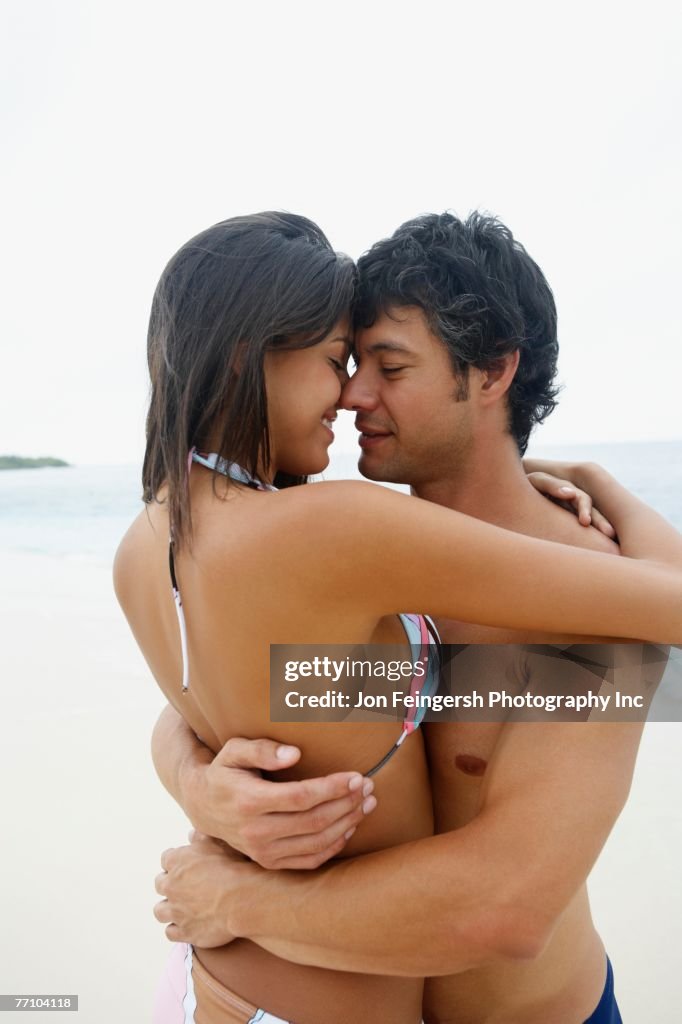 South American couple hugging