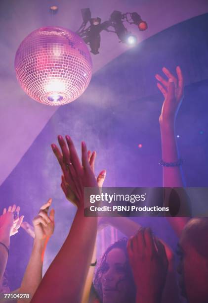 multi-ethnic people dancing at nightclub - dance floor stock pictures, royalty-free photos & images