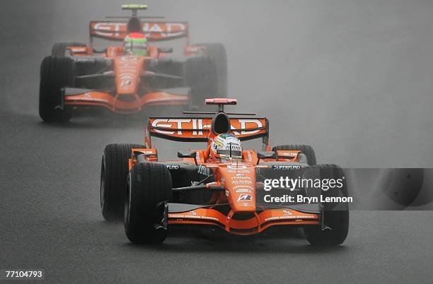 Adrian Sutil of Germany and Spyker F1 leads from team mate Sakon Yamamoto of Japan during qualifying for the Japanese Formula One Grand Prix at the...