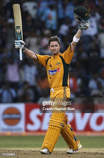 Michael Clarke of Australia celebrates his century during the first One Day International between India and Australia at M. Chinnaswamy Stadium on...