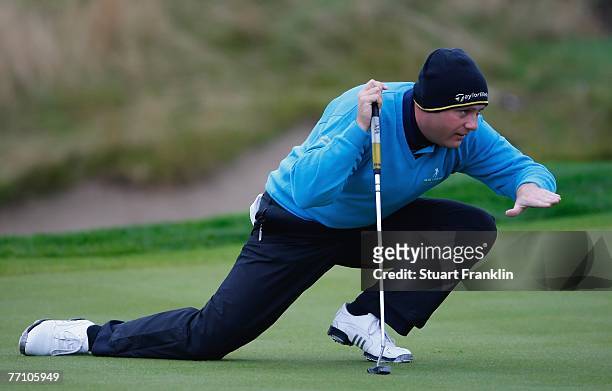 Graeme Storm of The Great Britain and Ireland Team ponders a putt on the third hole during the third day morning greensomes at the Seve Trophy 2007...