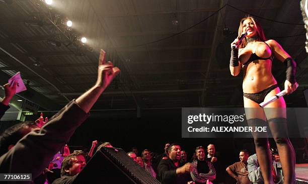 Florence Panoussian Miss Nude Australia speaks on stage during South Africa's first ever sex exhibition, "Sexpo," 27 September 2007 in Midrand, north...