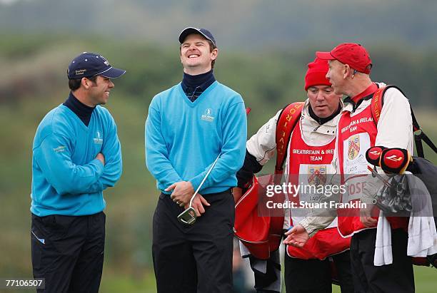 Justin Rose and Paul Casey of The Great Britain and Ireland Team with their caddies during the third day morning greensomes at the Seve Trophy 2007...