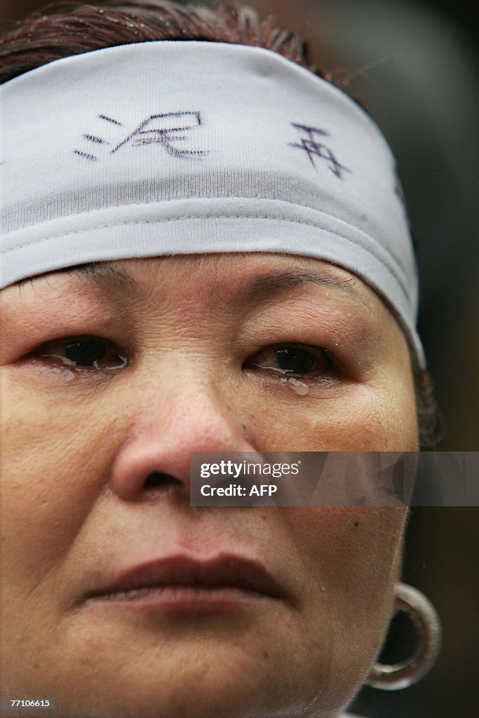 A woman protestor cries as she took part
