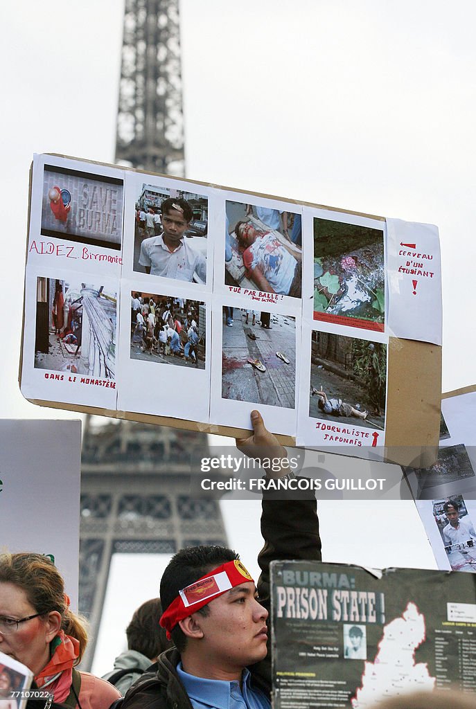 Protestors hold banners during a rally a