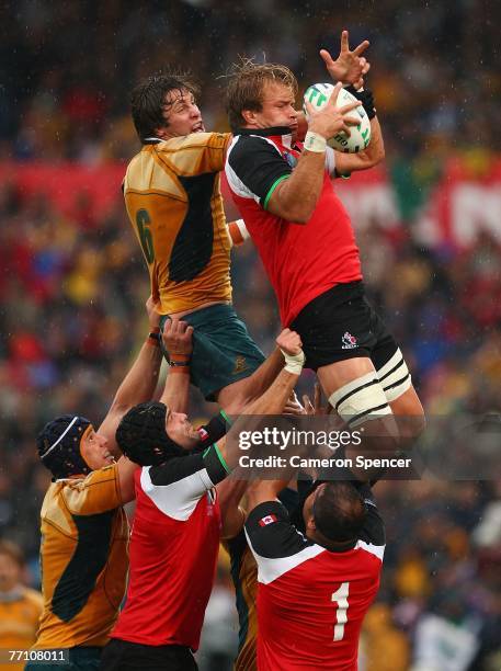 Hugh McMeniman of Australia contests a lineout ball with Mike James of Canada during the IRB Rugby World Cup Pool B match between Australia and...