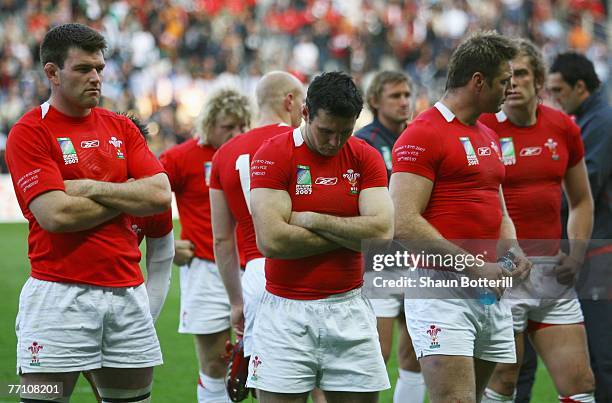 Dejected Welsh players look on after their 38-34 defeat during the Rugby World Cup 2007 Pool B match between Wales and Fiji at the Stade de la...