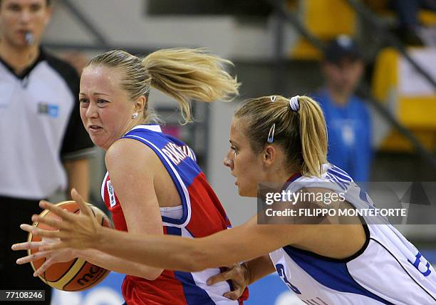 Russia's Oxana Rakhmatulina vies with Serbia's Milica Dabovic during their Group F qualifying round of the Women European Basketball Championships at...