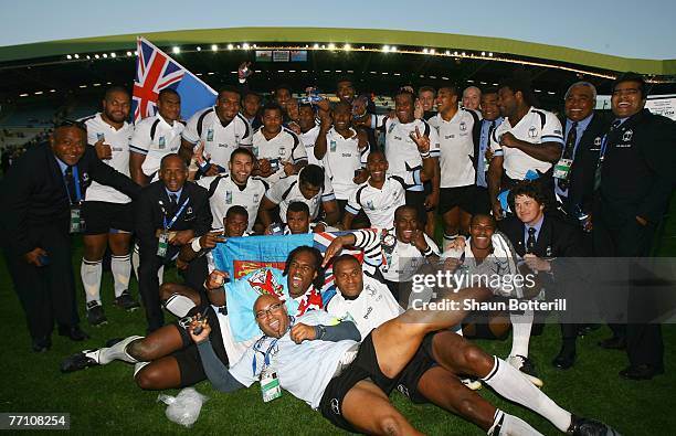 Fiji players celebrate following their team's 38-34 victory during the Rugby World Cup 2007 Pool B match between Wales and Fiji at the Stade de la...