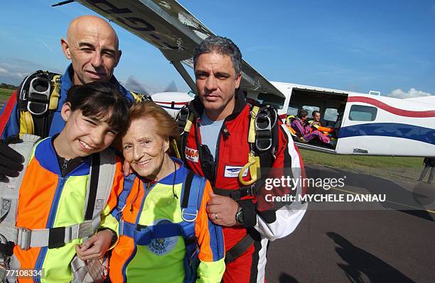 Ninety-five year old, French woman Blanche Olive and ten year old Pakistani-French teenager Oceane Malvy , pose with French paraglider pilots, Mario...