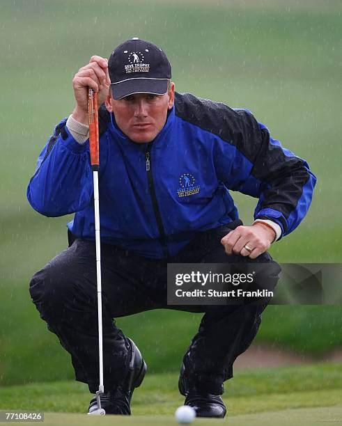 Robert Karlsson of The European Team lines up a putt on the 11th hole during the third day afternoon foursomes at the Seve Trophy 2007 held at The...