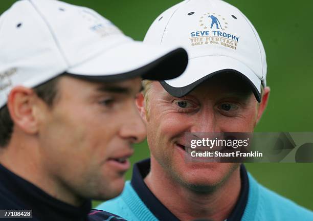 Oliver Wilson and Simon Dyson of The Great Britain and Ireland Team ponder a putt on the 15th hole during the third day afternoon foursomes at the...