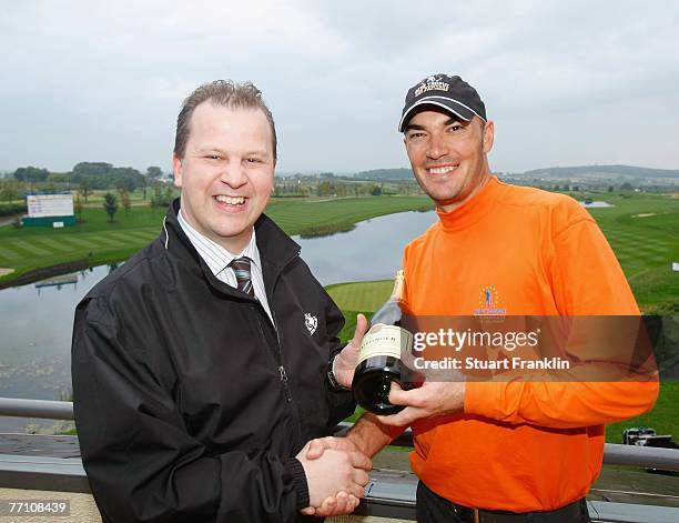 Donagh Davern, General Manager of The Heritage Golf and Spa Resort presents a bottle of Champange to Gregory Havret of The European Team after he...