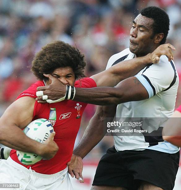 Colin Charvis of Wales is tackled high by Ifereimi Rawaqa of Fiji during the Rugby World Cup 2007 Pool B match between Wales and Fiji at the Stade de...