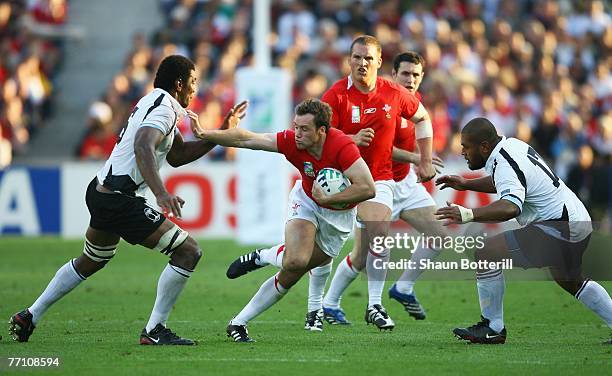 Mark Jones of Wales is hands off Ifereimi Rawaqa of Fiji during the Rugby World Cup 2007 Pool B match between Wales and Fiji at the Stade de la...