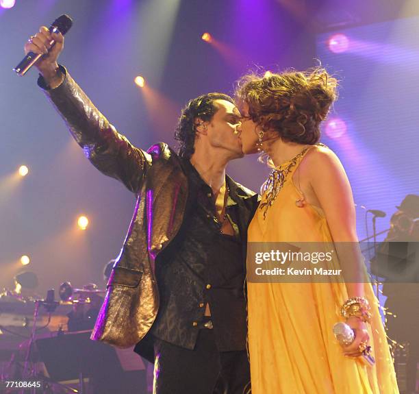 Singer Marc Anthony and Singer Jennifer Lopez perform at the Trump Taj Mahal Casino and Resort at the "En Concierto" tour opener on September 28,...