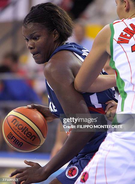 France's Sandra Dijon vies with Bielorussia's Anastasiya Veremeenko during their Group F qualifying round game in the Women's European Basketball...