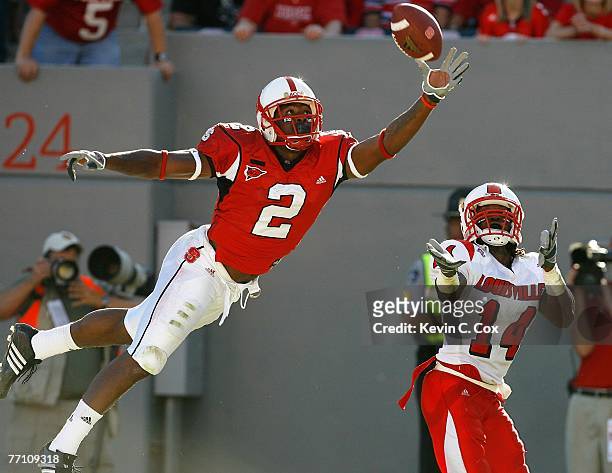 Receiver Darrell Blackman of the North Carolina State Wolfpack fails to pull in this touchdown reception against cornerback Rod Council of the...