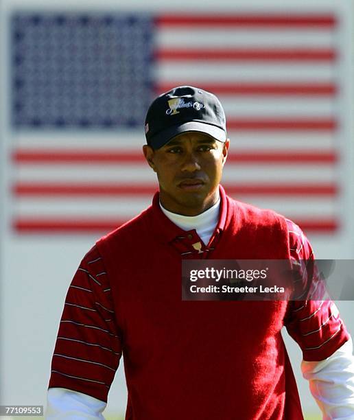 Tiger Woods of the U.S. Team watches on from the 10th hole during the third day Foursome matches at The Presidents Cup at The Royal Montreal Golf...