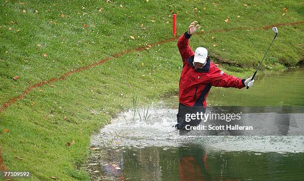 Woody Austin of the U.S. Team plays his second shot from the water at the par 4, 14th hole during the round two fourball matches at the Presidents...
