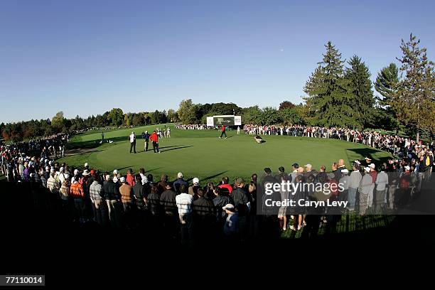 The audience watches the eighth green during round three of day six of The Presidents Cup at The Royal Montreal Golf Club September 29, 2007 in...