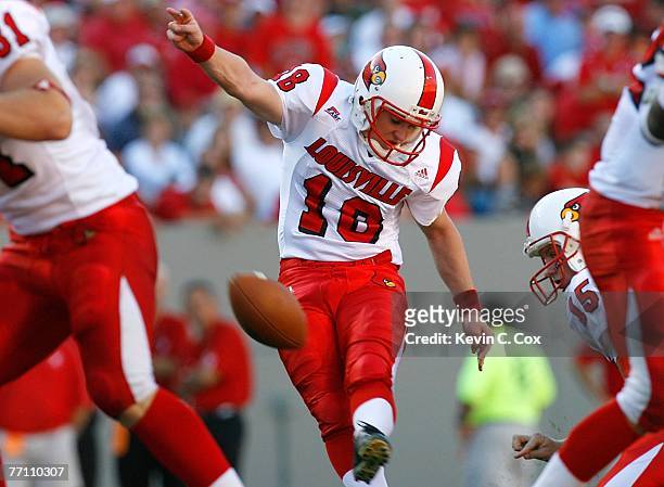Kicker Art Carmody of the Louisville Cardinals successfully kicks a field goal against the North Carolina State Wolfpack during the first half at...