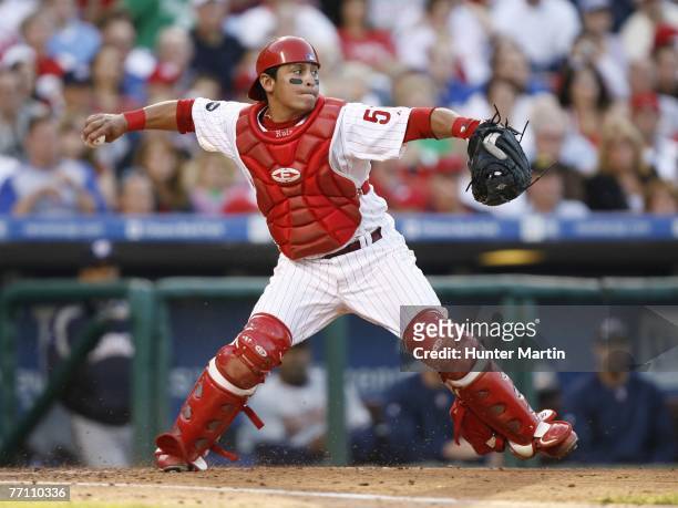 Catcher Carlos Ruiz of the Philadelphia Phillies throws to second base during a game against the Washington Nationals at Citizens Bank Park September...