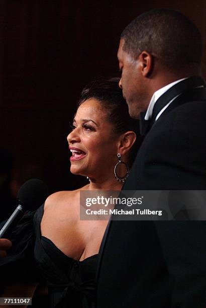 Actress/choreographer Debbie Allen does an interview as husband Norm Nixon looks on at the Fourth Annual Alfred Mann Foundation Gala, held at the...