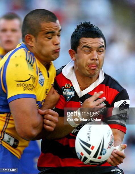 Joe Williams of the Bears is shoulder charged by Richard Fa'aoso of the Eels during the 2007 Premier League Grand Final between the Parramatta Eels...