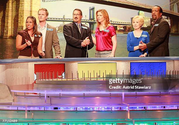 Megan Sippey, actor Neil Patrick Harris, Seth Ramus, actress Diane Neal, Diana Mallon and actor Robert Gossett guess at a puzzle during a taping of...