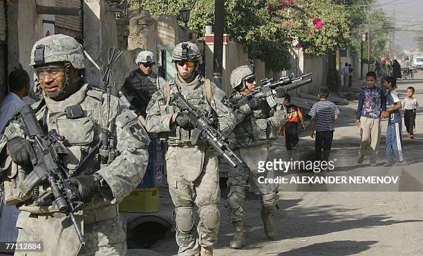 Soldiers from Alpha Company 1/38 Infantry Regiment patrol in downtown Baquba, 30 September 2007, some 50 kms north-east from Bagdad. US military...