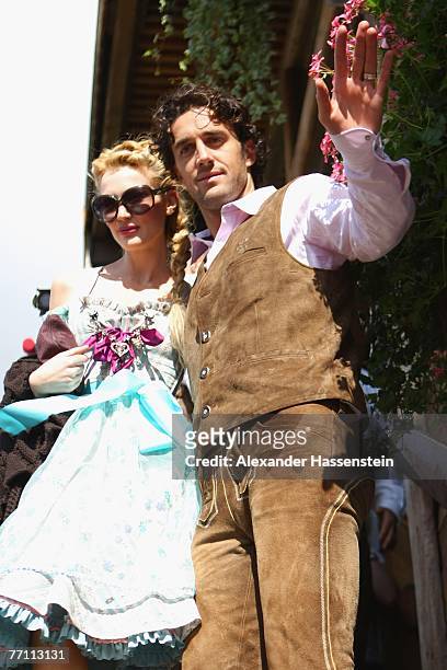 Bayern Munich?s player Luca Toni arrives with his wife Marta Cecchetto at the Kaefer?s party tent for a day at the Oktoberfest on September 30, 2007...