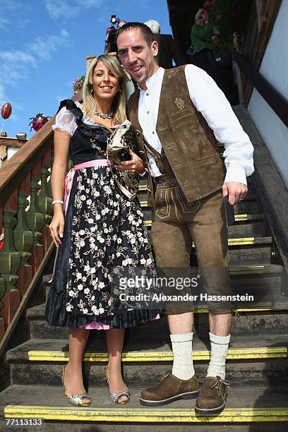 Bayern Munich?s player Frank Ribery arrives with his wife Wahiba Ribery at the Kaefer?s party tent for a day at the Oktoberfest on September 30, 2007...
