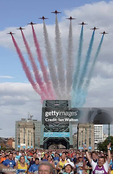 Runners cross the Tyne Bridge as the Red Arrows fly over during the Bupa Great North Run at South Shields on September 30, 2007 in Newcastle, England.