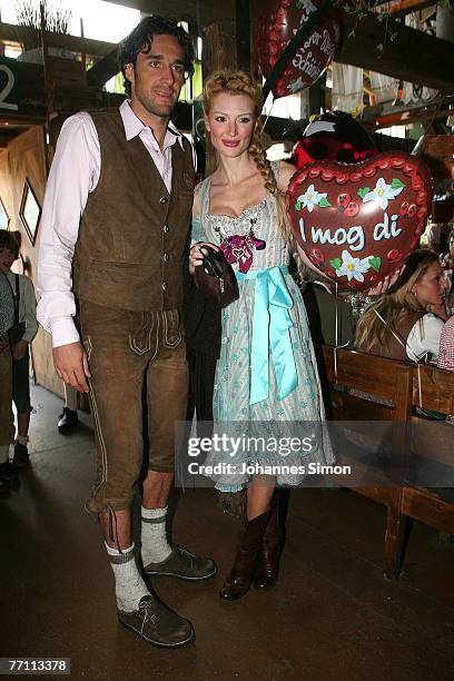 Luca Toni and his girlfriend Marta Cecchetto arrive at the Kaefers party tent for a day at the Oktoberfest on September 30, 2007 in Munich, Germany.