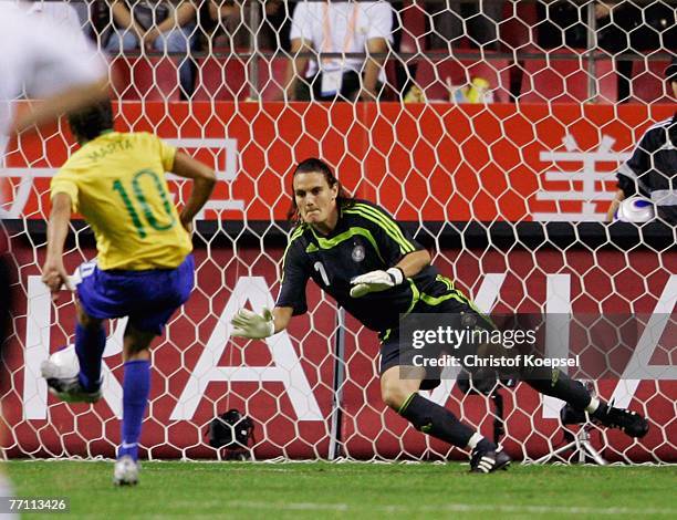 Nadine Angerer of Germany dives to save the penalty of Marta of Brazil during the Women's World Cup 2007 Final match between Brazil and Germany at...