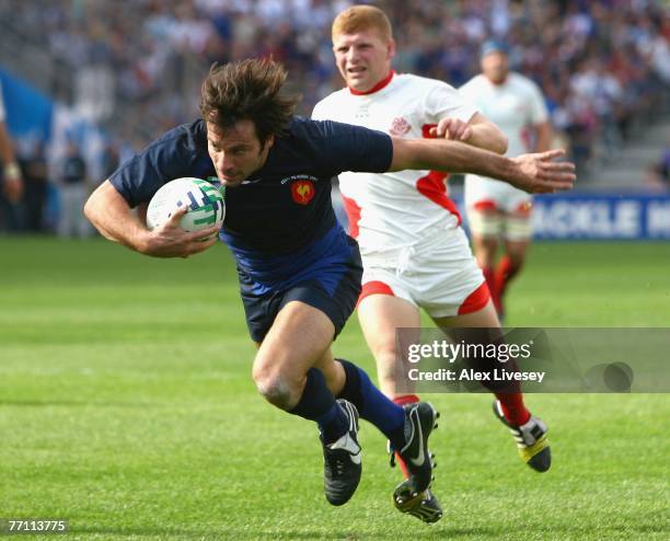 Christophe Dominici of France surges forward to score his team's sixth try during Match Thirty Eight of the Rugby World Cup 2007 between France and...