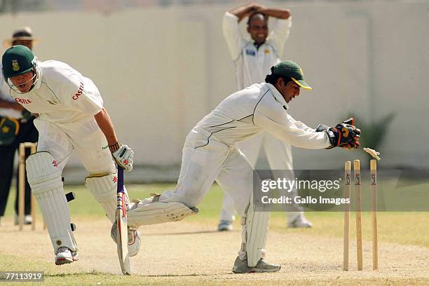 Paul Harris almost run out by Sarfaraz Ahmed during the 2nd day of the 3 day warm up match between South Africa and Patron's XI held at NBP Sports...