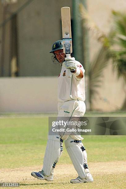 Mark Boucher celebrates his 100 during the 2nd day of the 3 day warm up match between South Africa and Patron's XI held at NBP Sports Complex on...