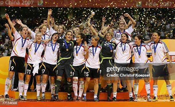 The German team celebrates with the winning trophee oin the podium after winning the Women's World Cup 2007 Final match between Brazil and Germany at...