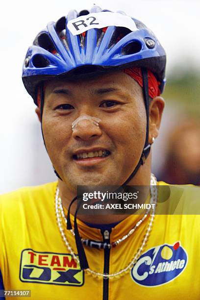 Japan's Masazumi Soejima celebrates placing first in the wheel-chair event of the 34th Berlin Marathon 30 September 2007. Haile Gebreselassie broke...