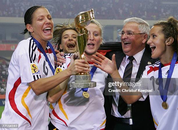 Linda Bresonik, Sandra Smisek, Anja Mittag, German Football Association President Theo Zwanziger and Fatmire Bajramaj celebrae with the winning...