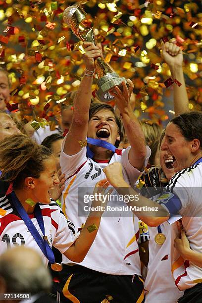 Defender Ariane Hingst of Germany raises the FIFA Women's World Cup 2007 trophy after defeating Brazil 2-0 at Shanghai Hongkou Football Stadium on...