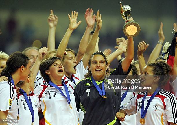 Goalkeeper Nadine Angerer of Germany raises the FIFA Women's World Cup 2007 trophy after defeating Brazil 2-0 at Shanghai Hongkou Football Stadium on...