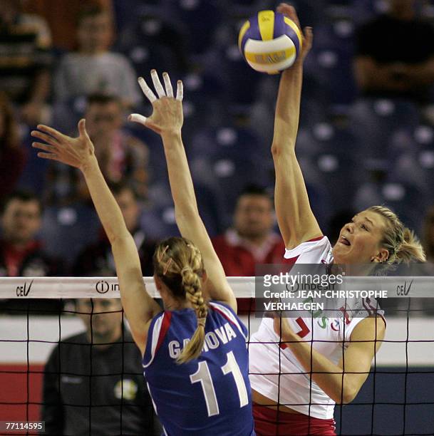 Russia's Ekaterina Gamova blocks as Poland's Malgorzata Glinka attacks during their final for the third place of European volleyball championships,...