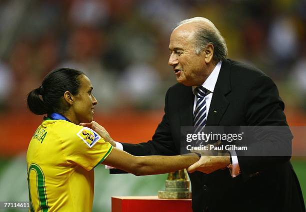 President Sepp Blatter presents Marta Vieira Da Silva of Brazil with her runners up medal during the Women's World Cup 2007 Final between Brazil and...