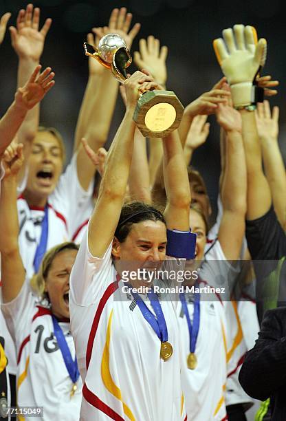 Forward Birgit Prinz of Germany raises the FIFA Women's World Cup 2007 trophy after defeating Brazil 2-0 at Shanghai Hongkou Football Stadium on...