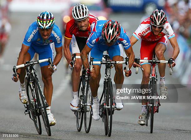 Italy's Paolo Bettini , Germany Stefan Schumacher , Russia's Alexandr Kolobnev and Luxembourg's Frank Schleck sprint in the men's road race during...