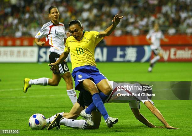 Marta Vieira Da Silva of Brazil battles for the ball with Annike Krahn of Germany during the Women's World Cup 2007 Final between Brazil and Germany...